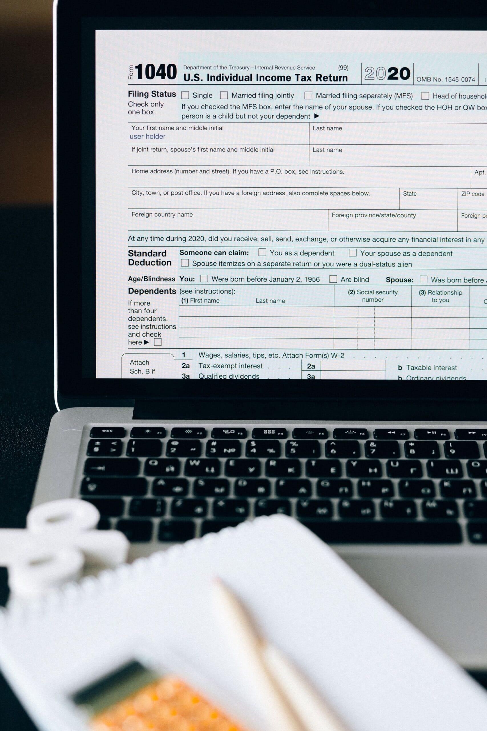 TurboTax vs H&R Block vs TaxAct vs FreeTaxUSA 2025 tax return form on laptop